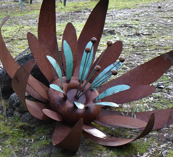Aqua and rust ground flower, scrap metal garden art, Tread Sculptures, Melbourne
