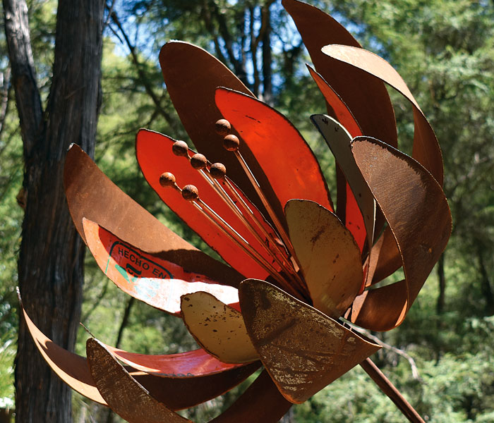 Metal garden sculpture, giant red rusty flower