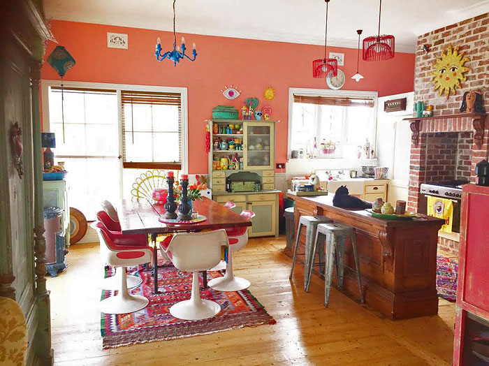 Upcycled furniture and kitchen styling inside a fully relocated, upcycled home.