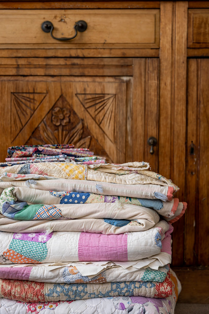 Vintage quilts collected for repurposing at Wattle&Loop